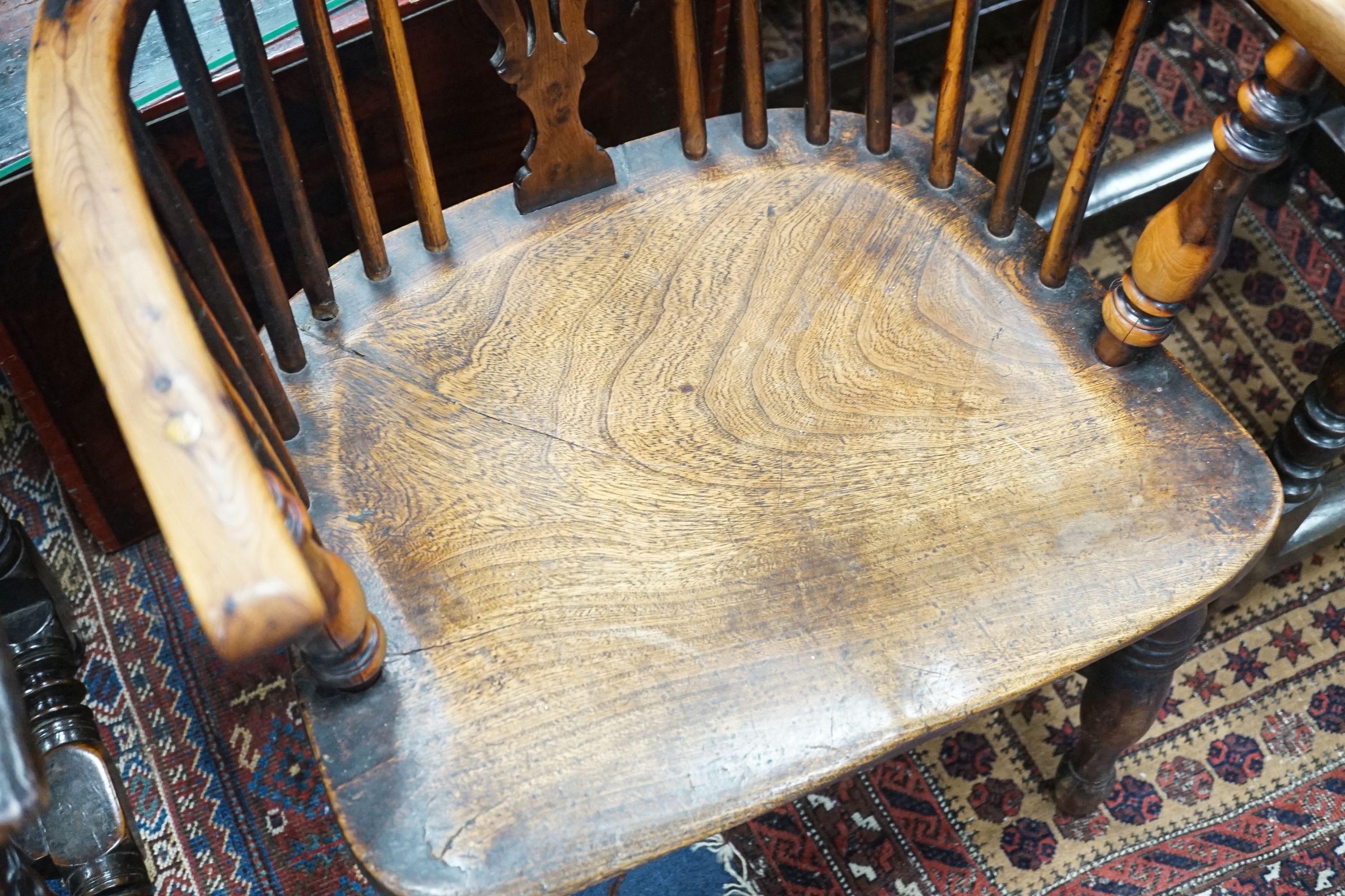 A 19th century Midlands area yew and elm Windsor armchair with crinoline stretcher, width 54cm, depth 40cm, height 108cm